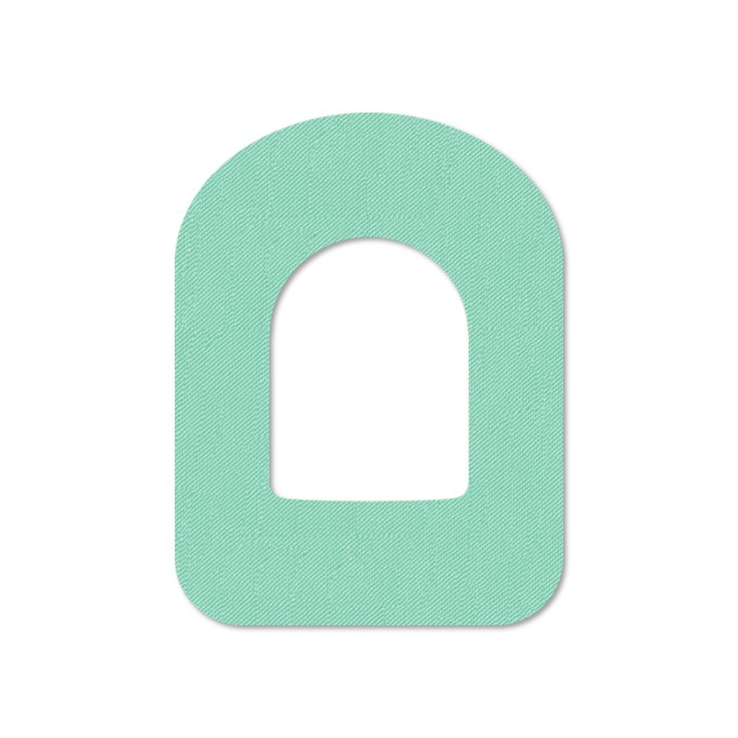 Cerotto color pelle con foro ovale. Materiale color menta con trama. Forma arrotondata.