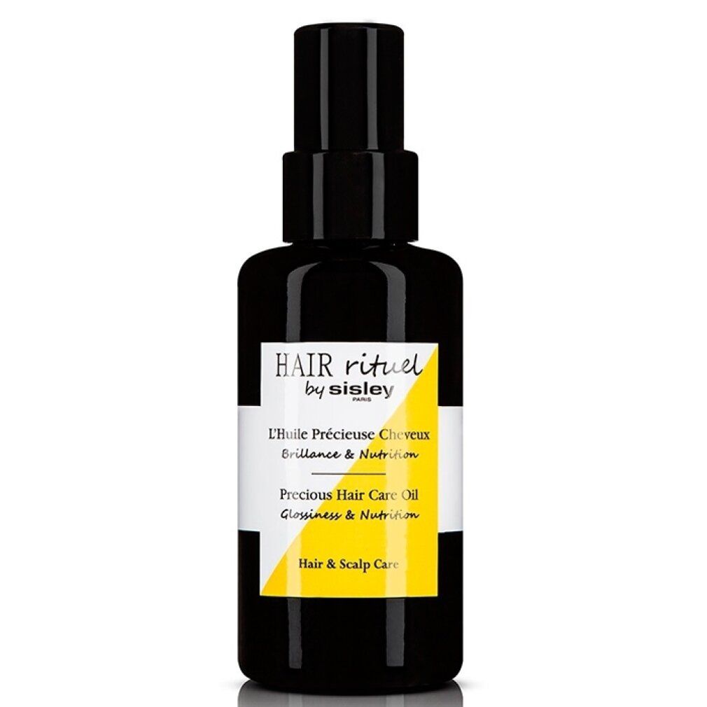 Flacone nero con etichetta gialla. Scritta: Hair Rituel by Sisley, L'Huile Précieuse Cheveux, Precious Hair Care Oil.