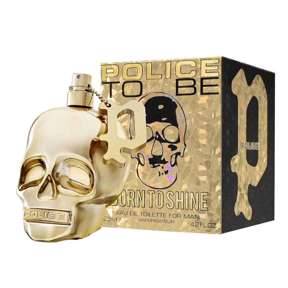 Flacone dorato a forma di teschio accanto alla confezione. Scritta: POLICE TO BE BORN TO SHINE.