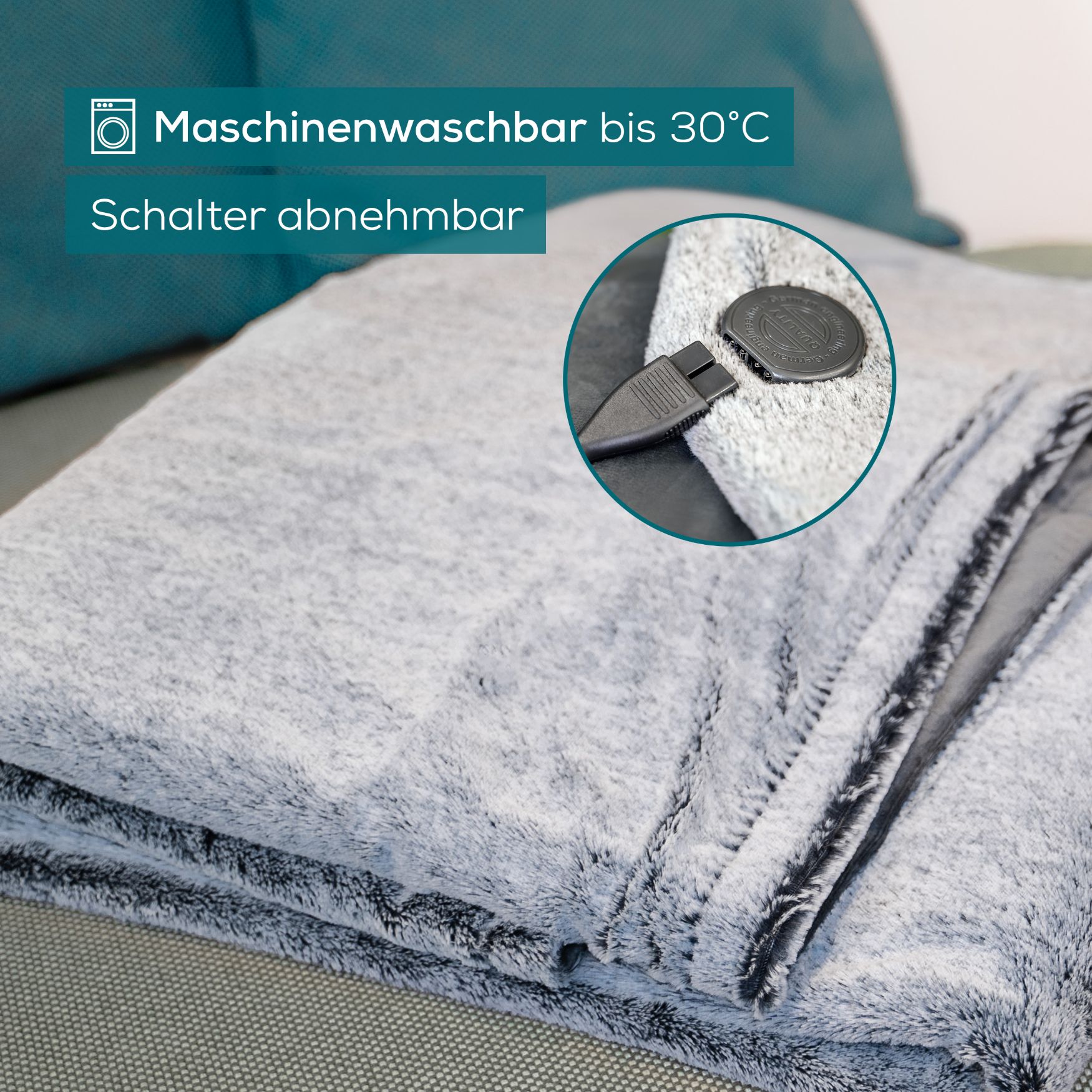 Coperta termica grigia con interruttore rimovibile. Lavabile in lavatrice fino a 30°C.