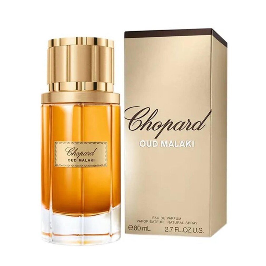 Flacone di profumo e confezione. Scritta "Chopard Oud Malaki". Confezione dorata, flacone con liquido dorato.