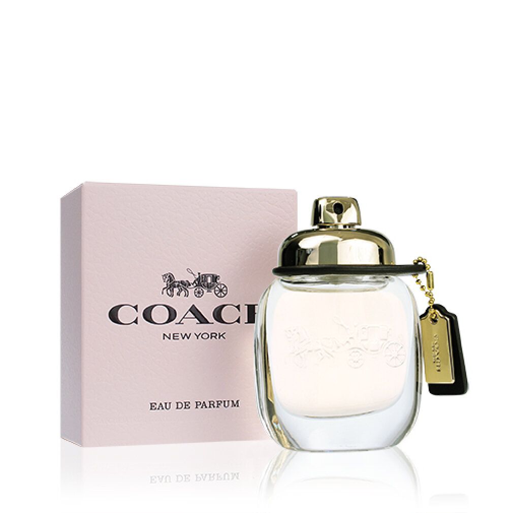 Flacone di profumo e confezione. Flacone con tappo e ciondolo dorati. Logo Coach sulla confezione.