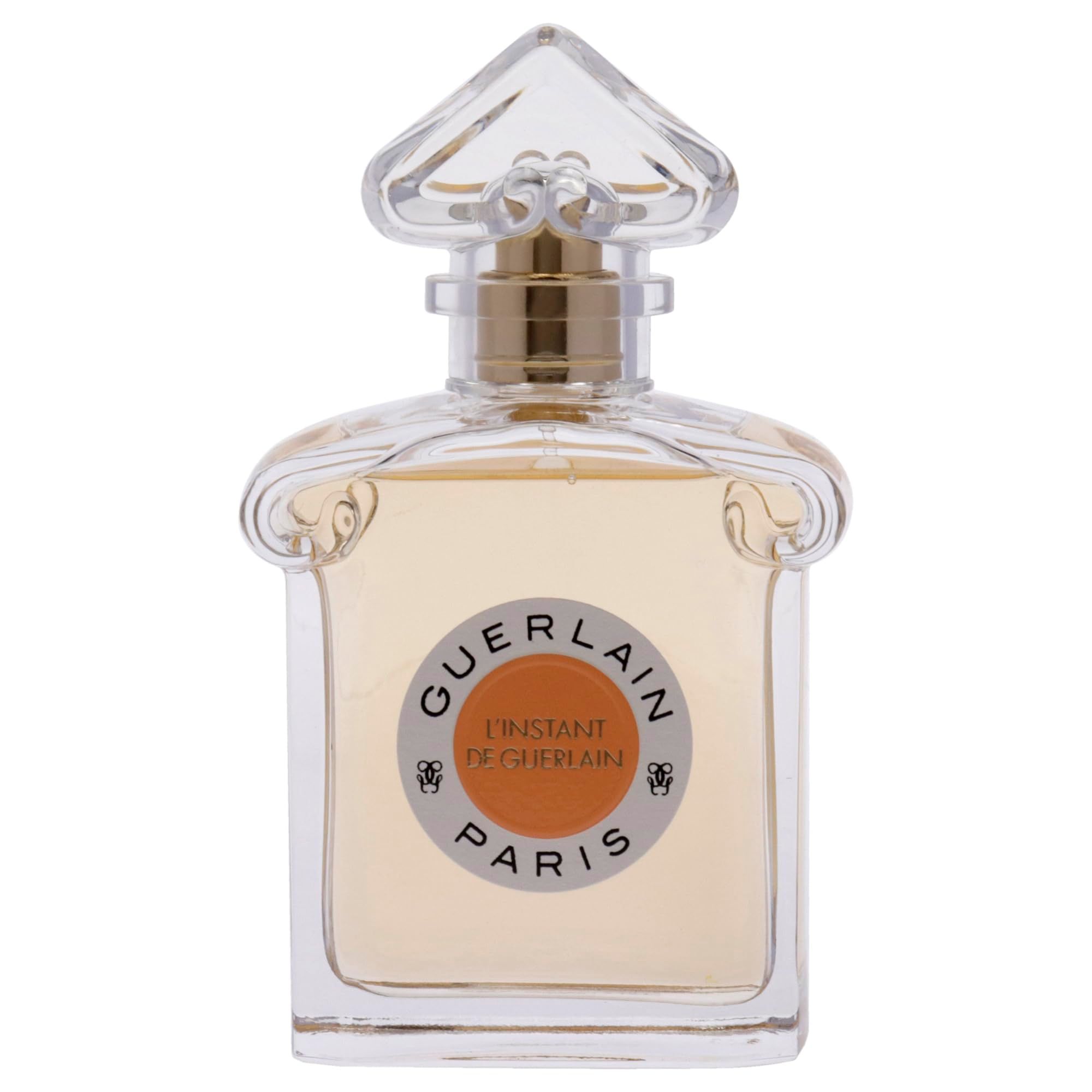 Flacone quadrato con tappo trasparente. L'etichetta riporta "L'Instant de Guerlain Paris".