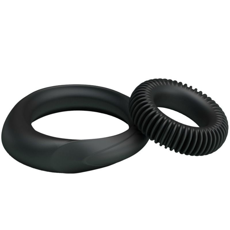 Due anelli neri. Un anello con una forma rialzata, l'altro con superficie scanalata. In silicone.