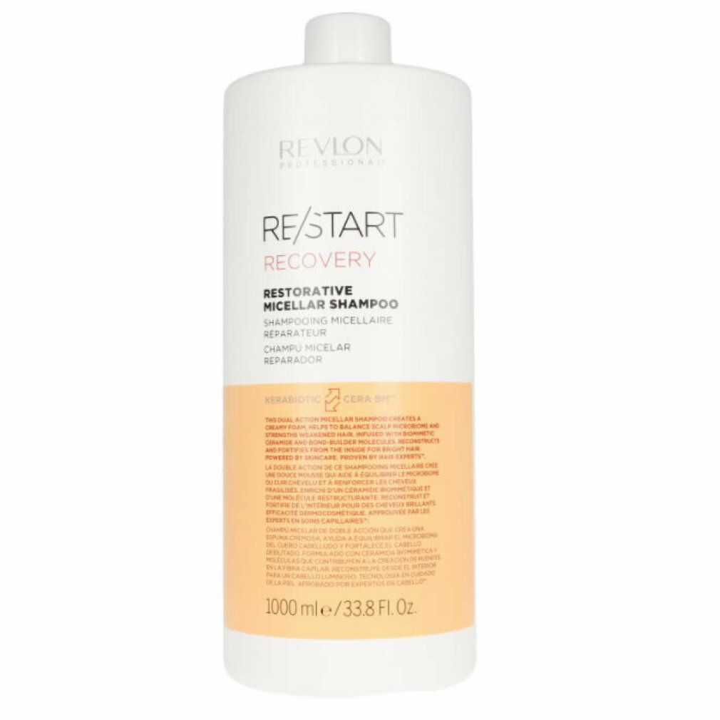 Flacone di shampoo bianco con scritta RE/START RECOVERY. Striscia arancione con testo. 1000 ml/33.8 Fl. Oz.