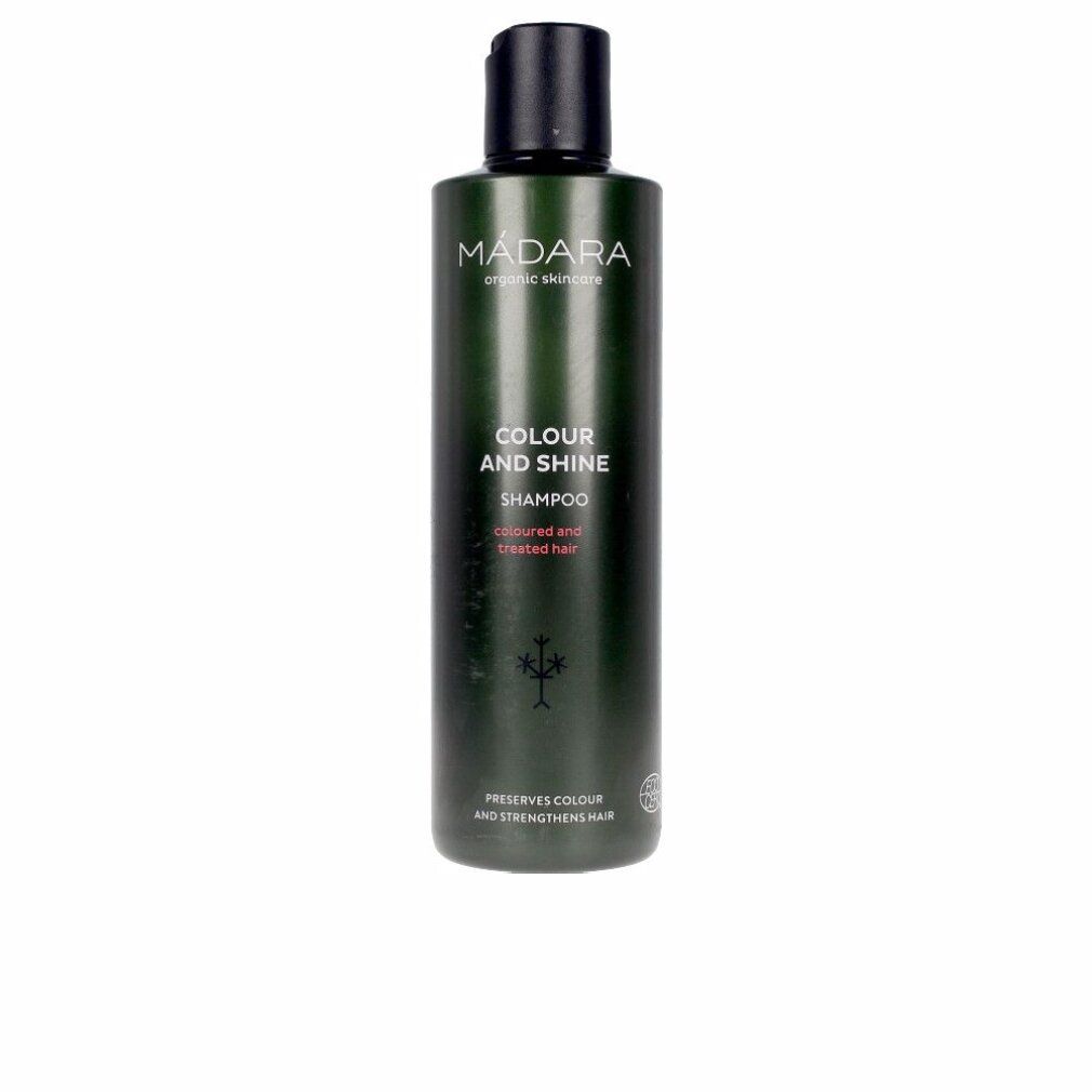 Flacone di shampoo verde con tappo nero. Scritta: MÁDARA, Colour and Shine Shampoo. Per capelli colorati.