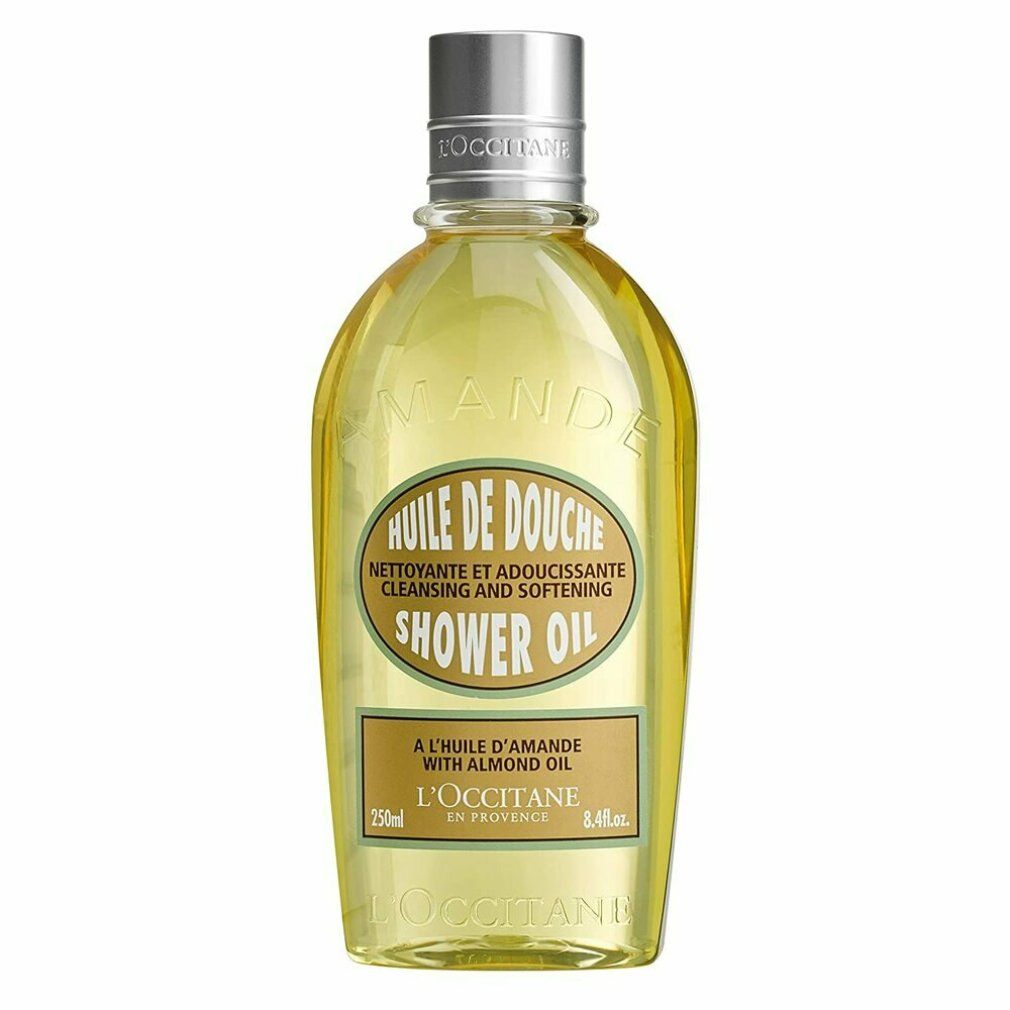 Flacone ovale di olio doccia, tappo argentato. Scritta: Huile de Douche, olio di mandorle, 250ml, L'Occitane. Trasparente.