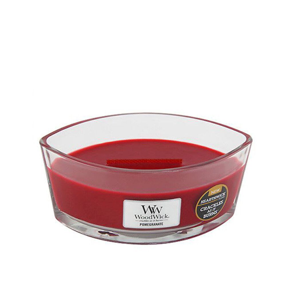 Candela Ellisse con cera rossa. Contenitore in vetro con stoppino in legno. Etichetta con logo e 'Pomegranate'.