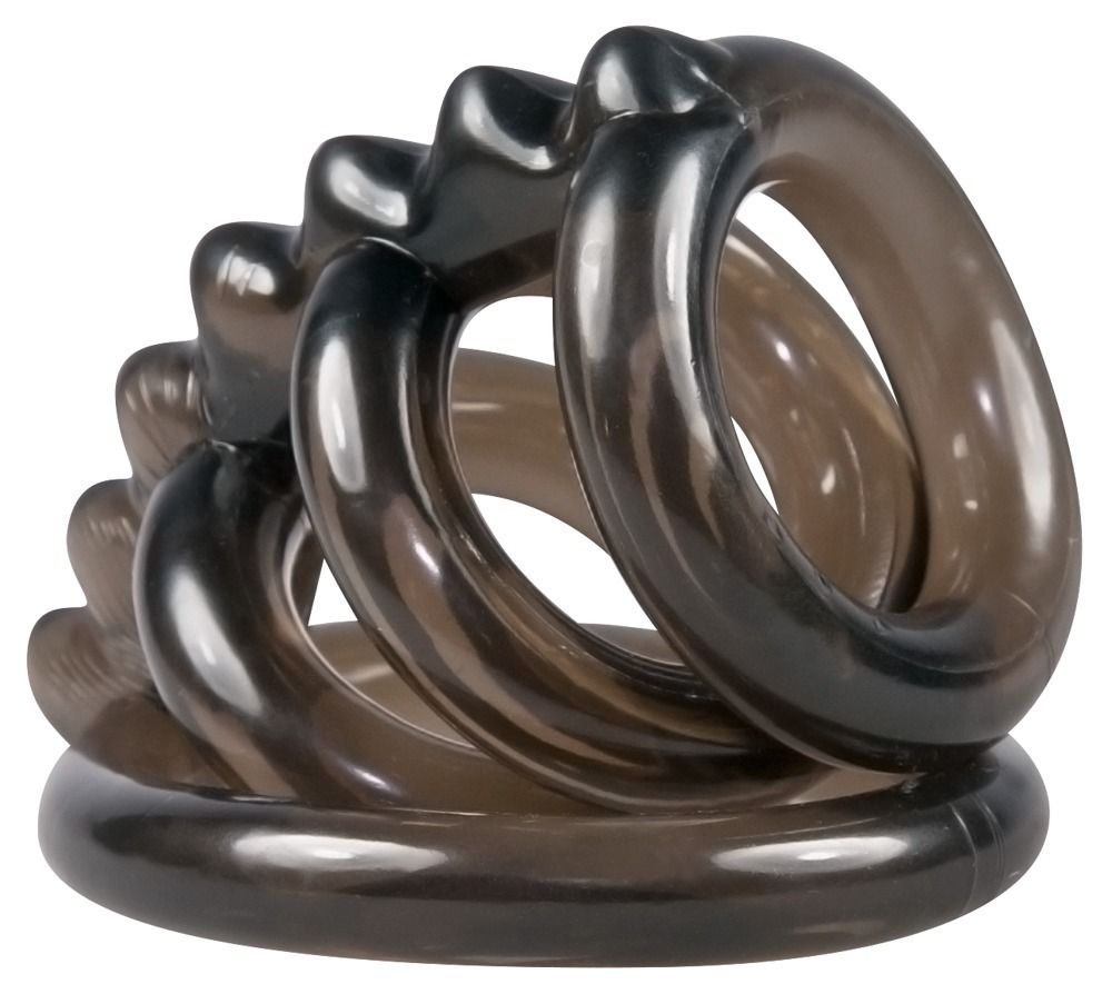 Anello per pene nero con quattro anelli e barra ondulata. Diversi anelli si sovrappongono.