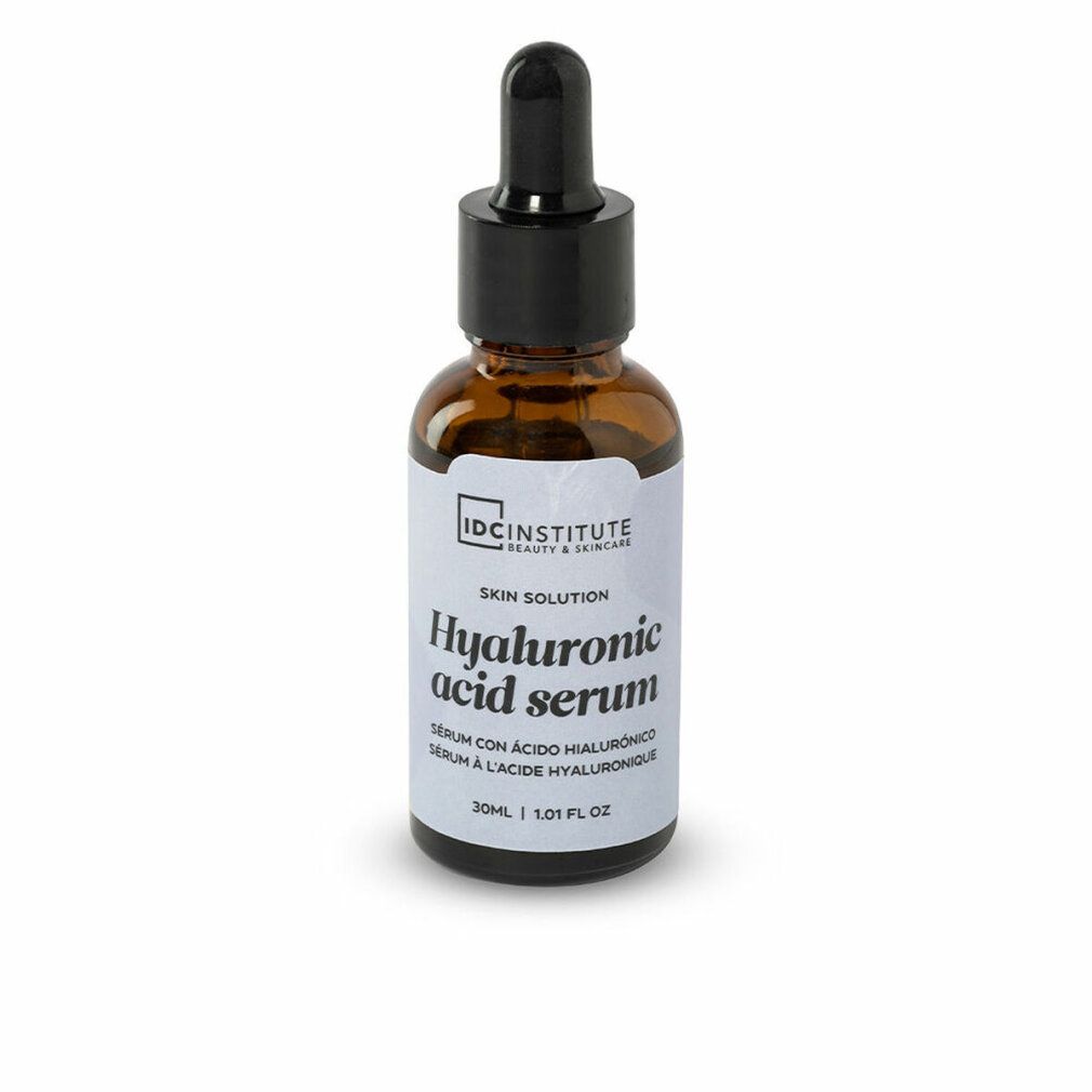 Flacone di vetro marrone con tappo nero e contagocce. Etichetta con "Hyaluronic acid serum" e "IDC INSTITUTE".