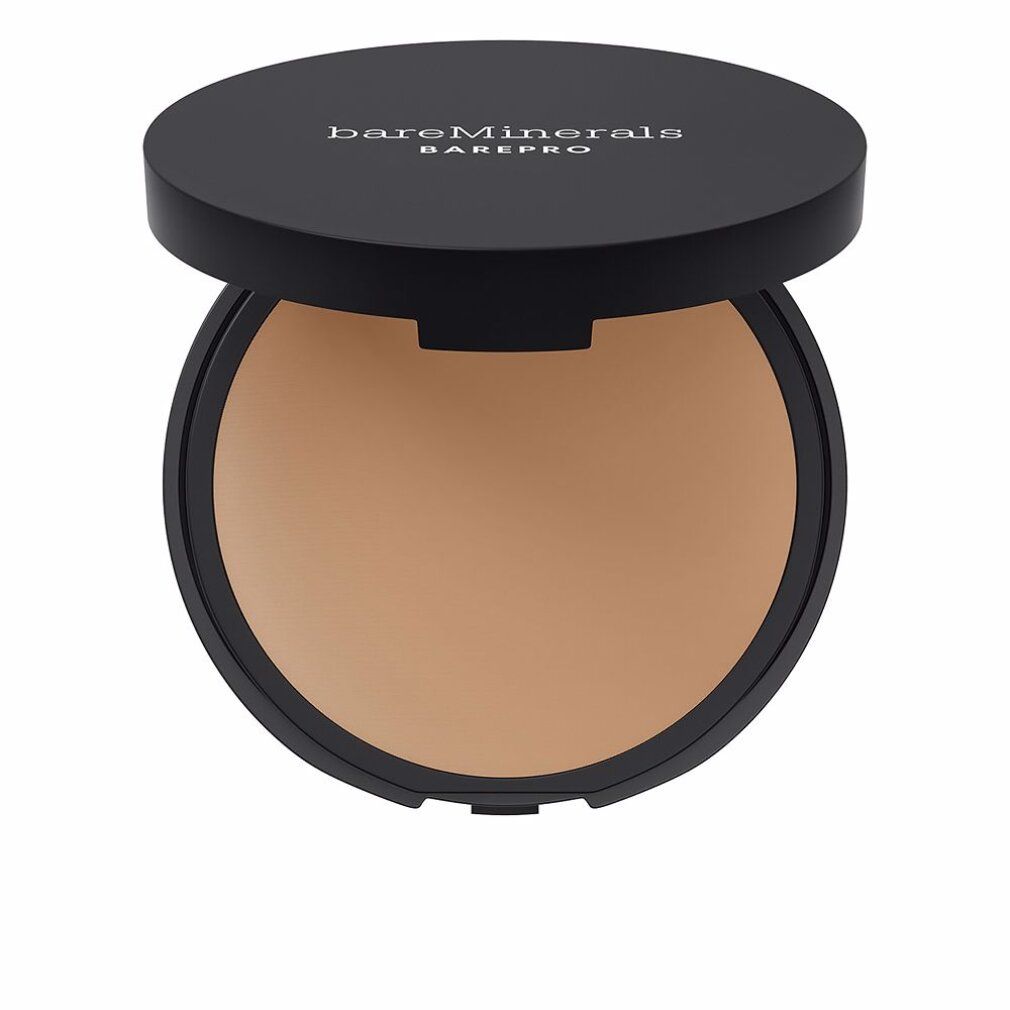 Contenitore rotondo nero con coperchio aperto. Trucco in polvere beige all'interno. Scritta bianca sul coperchio: bareMinerals BAREPRO.