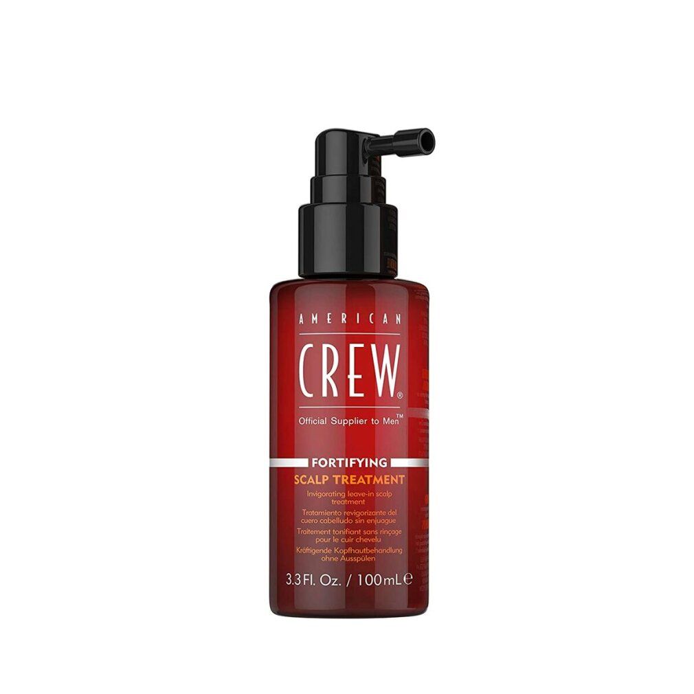 Flacone marrone con pompa. Scritta: American Crew, trattamento del cuoio capelluto. 3,3 fl.oz./100ml.