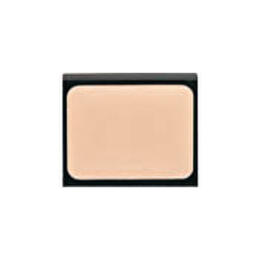 Crema camouflage beige in confezione rettangolare nera. Angoli arrotondati. Coperchio chiuso.