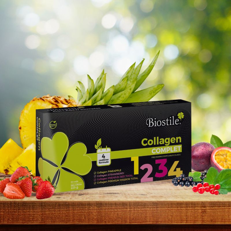 Confezione Biostile Collagen Komplett su legno, con ananas, fragole e frutto della passione.