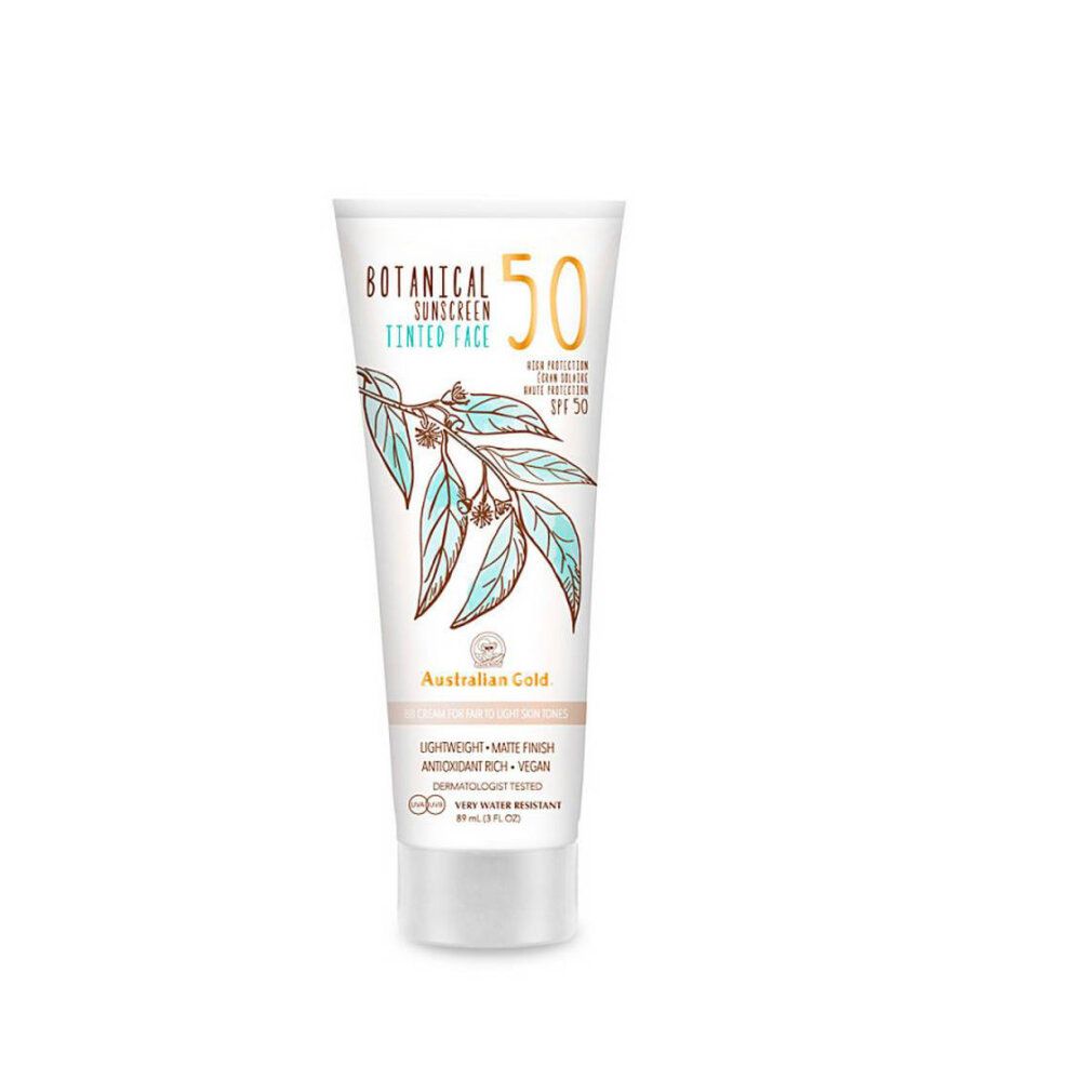 Tubo crema solare. Bianco, design botanico, testo: SPF 50, Australian Gold. Per pelli chiare. Dermatologicamente testato.