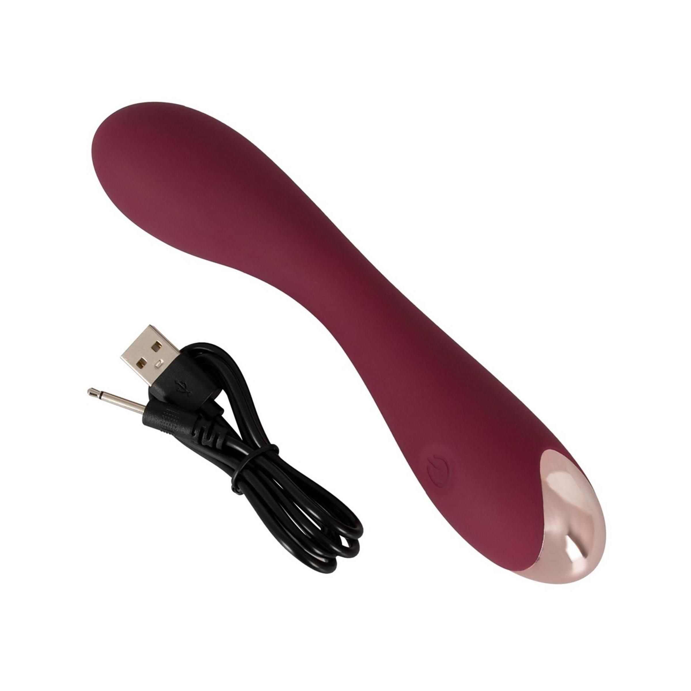Vibratore bordeaux con cavo di ricarica USB. Punta metallica e pulsante.