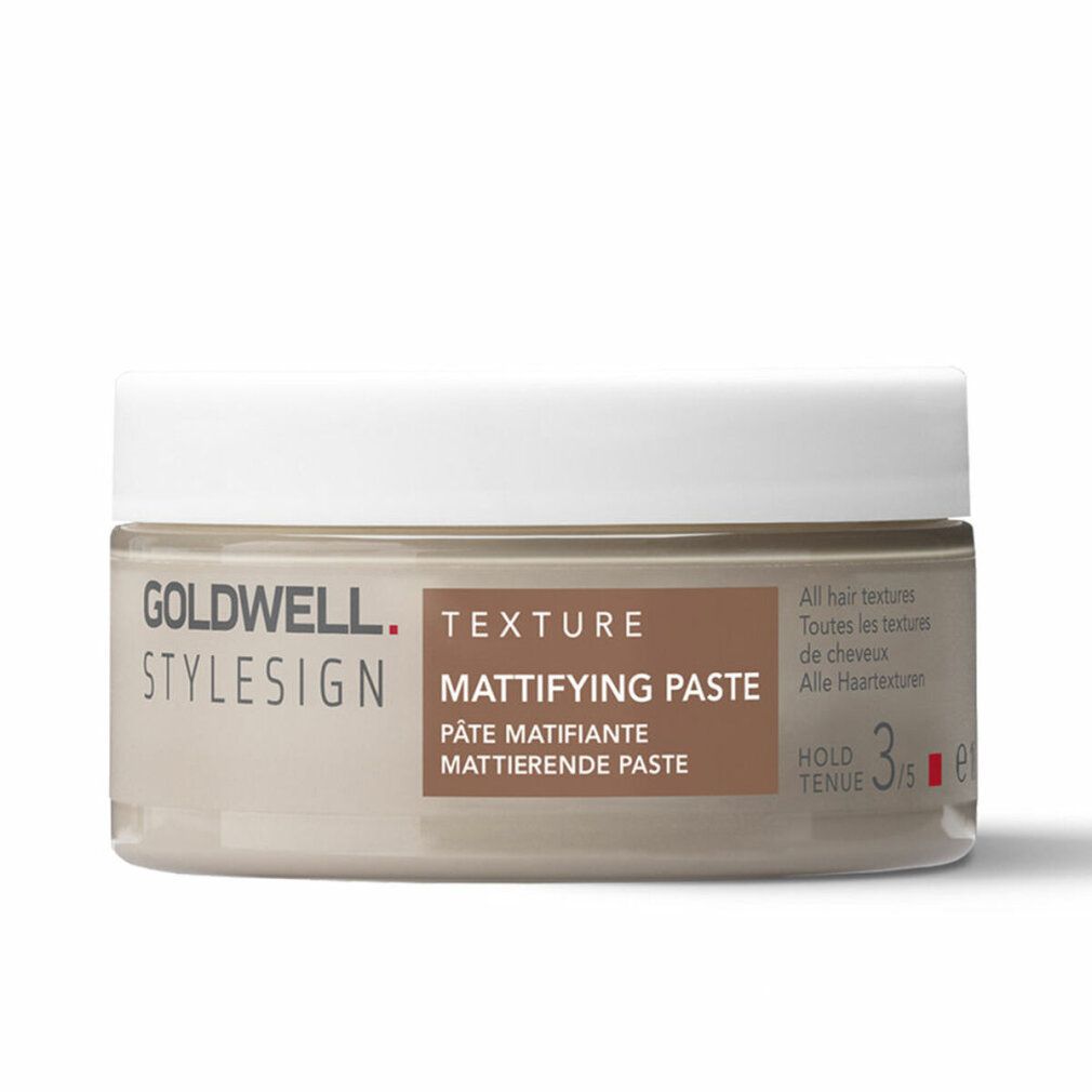 Goldwell Stylesign Texture Mattifying Paste. Barattolo beige con coperchio bianco. Nome del prodotto e marchio visibili.