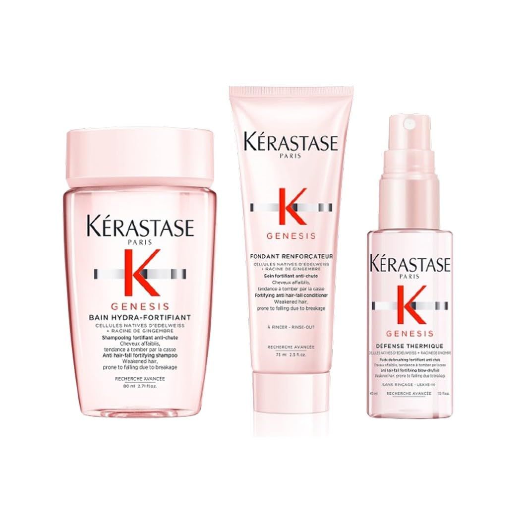 Tre prodotti Kérastase Genesis: shampoo, balsamo e spray termico. Flaconi rosa.