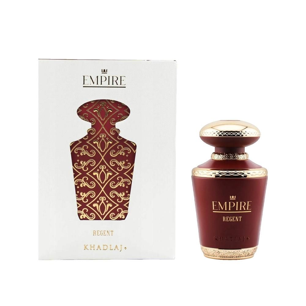 Flacone di profumo e confezione. Flacone rosso con tappo dorato. Confezione bianca con motivo rosso e testo.