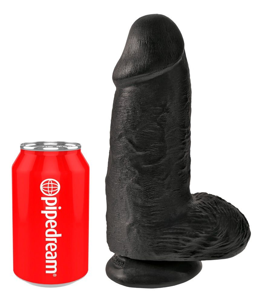 Dildo nero accanto a una lattina rossa. Dildo con texture realistica e forma arrotondata.