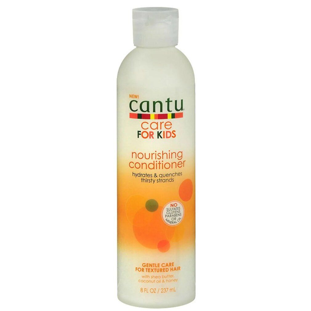 Flacone bianco Cantu Care For Kids. Etichetta con cerchi arancioni e gialli. Testo: Nourishing Conditioner.