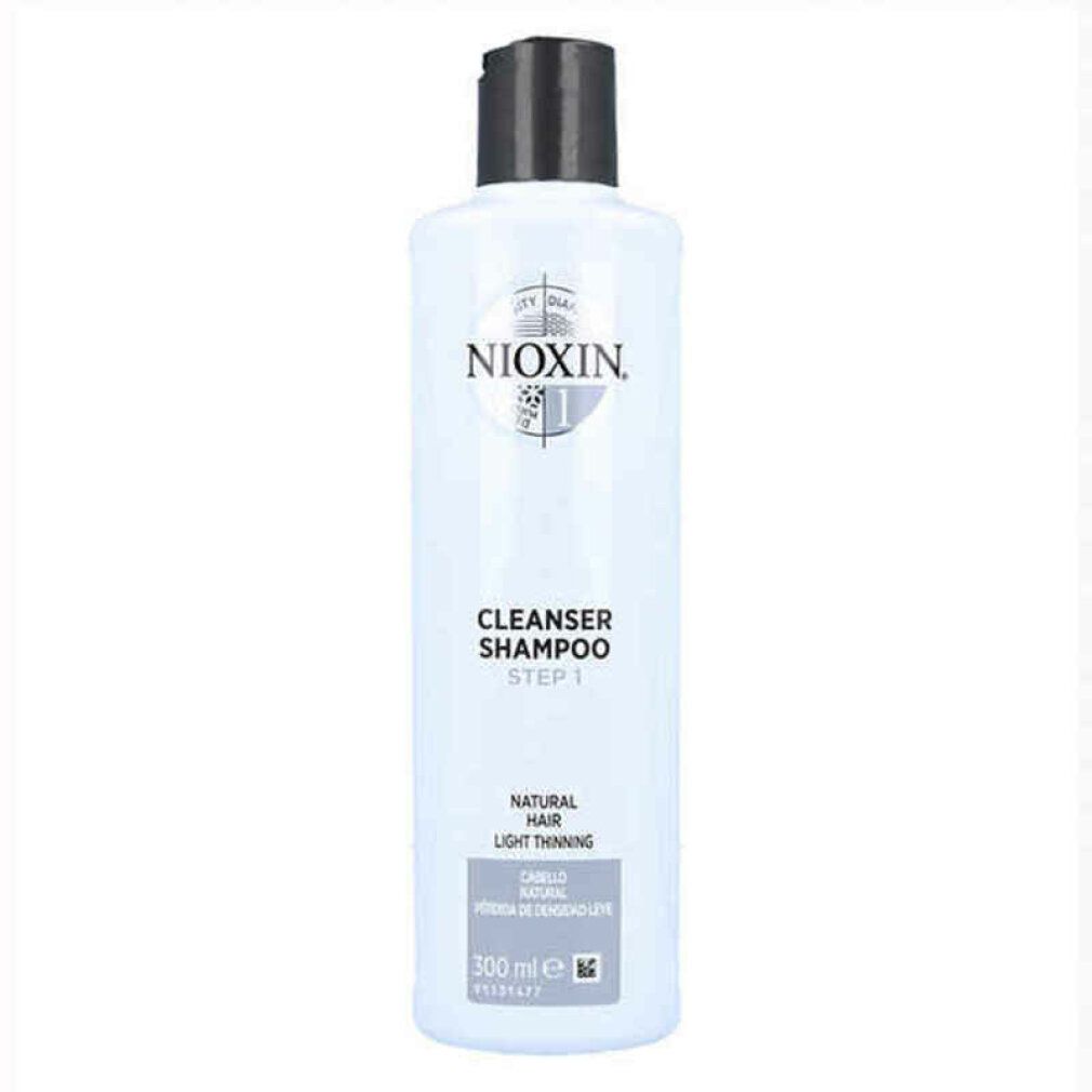 Flacone di shampoo bianco con tappo nero. Scritta: Nioxin, Cleanser Shampoo, Step 1. Per capelli fini. Volume.