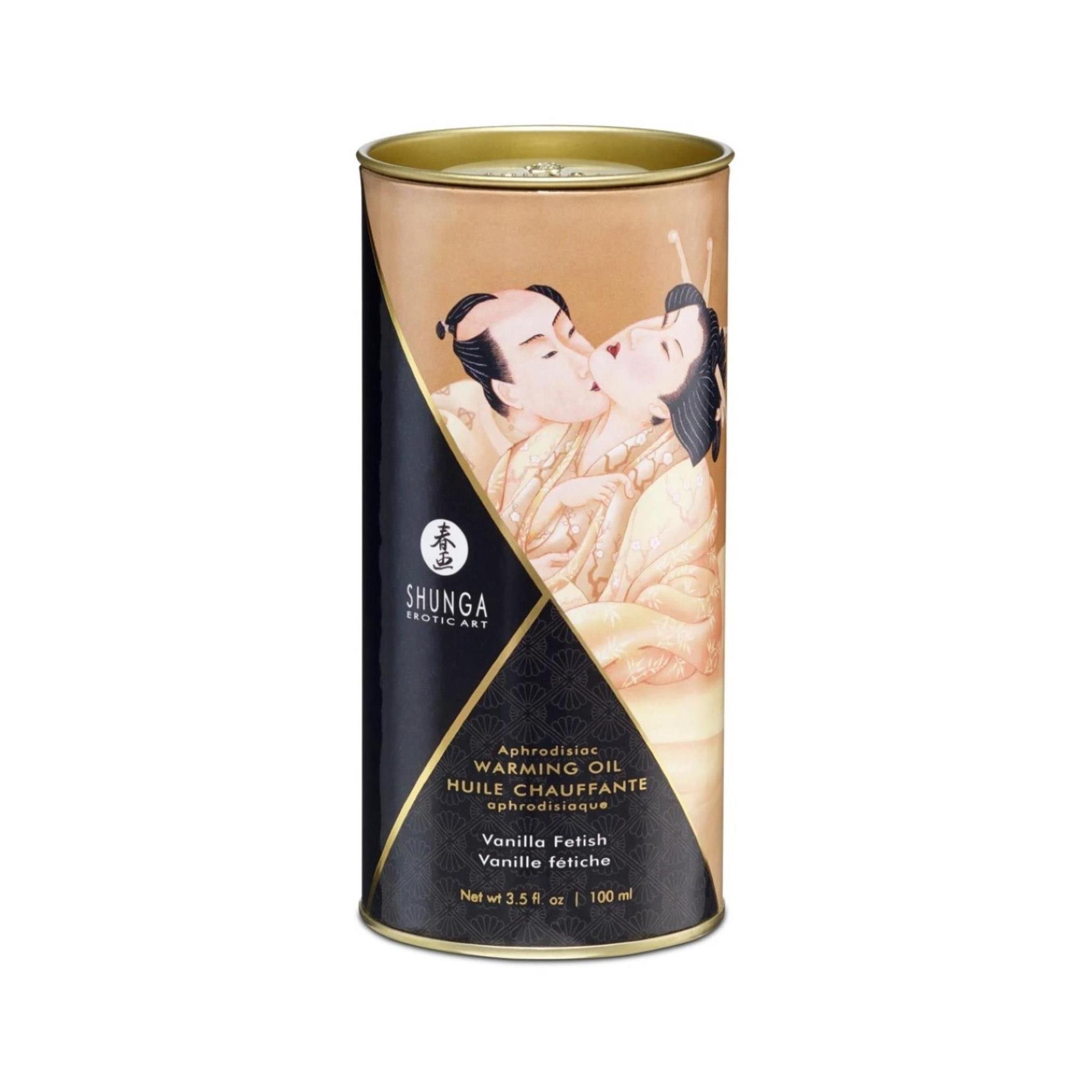 Confezione cilindrica con immagine. Testo: Shunga, Warming Oil, Vanilla Fetish. Coperchio dorato, sfondo nero.