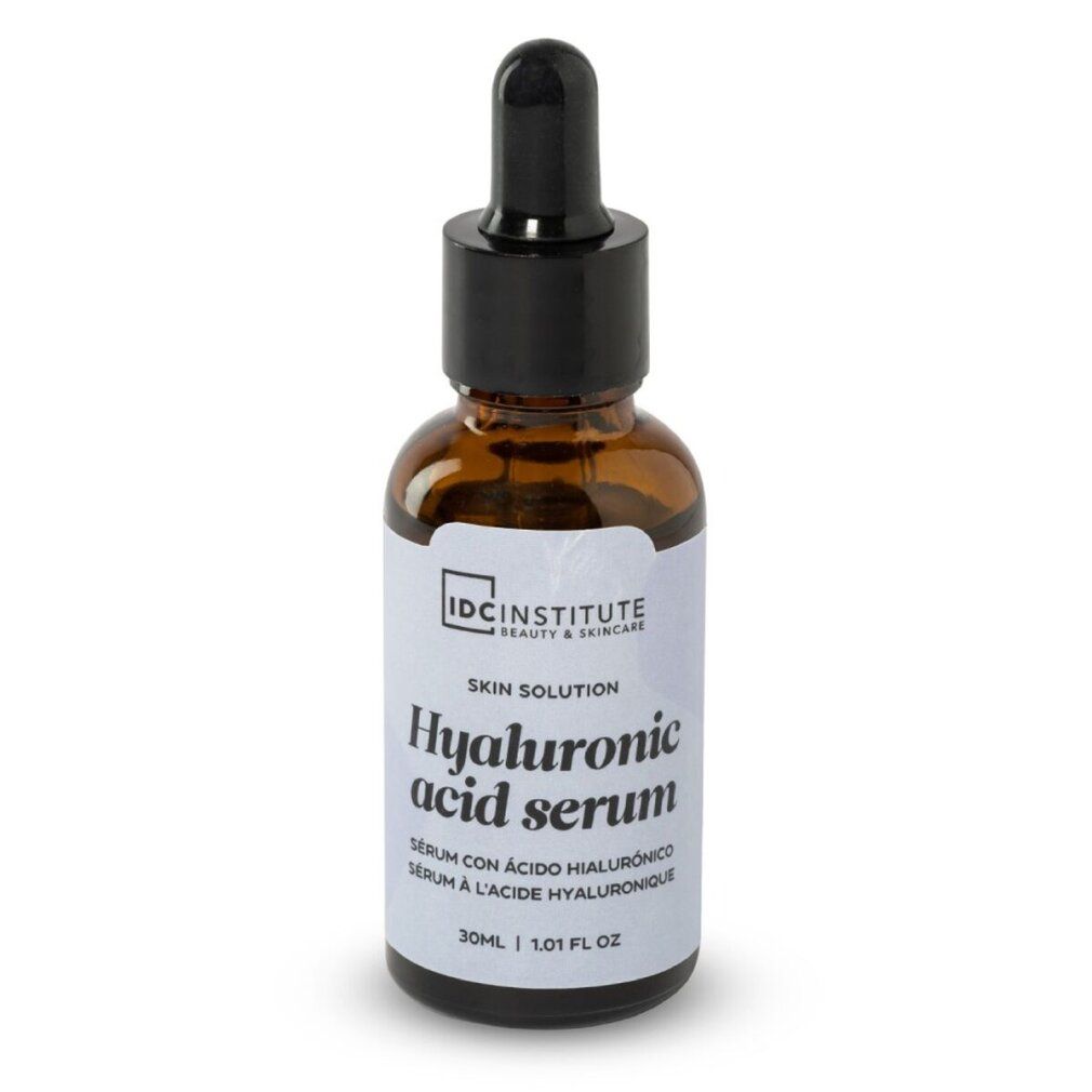 Flacone di vetro marrone con tappo nero e contagocce. Etichetta con "Hyaluronic acid serum" e "IDC INSTITUTE".