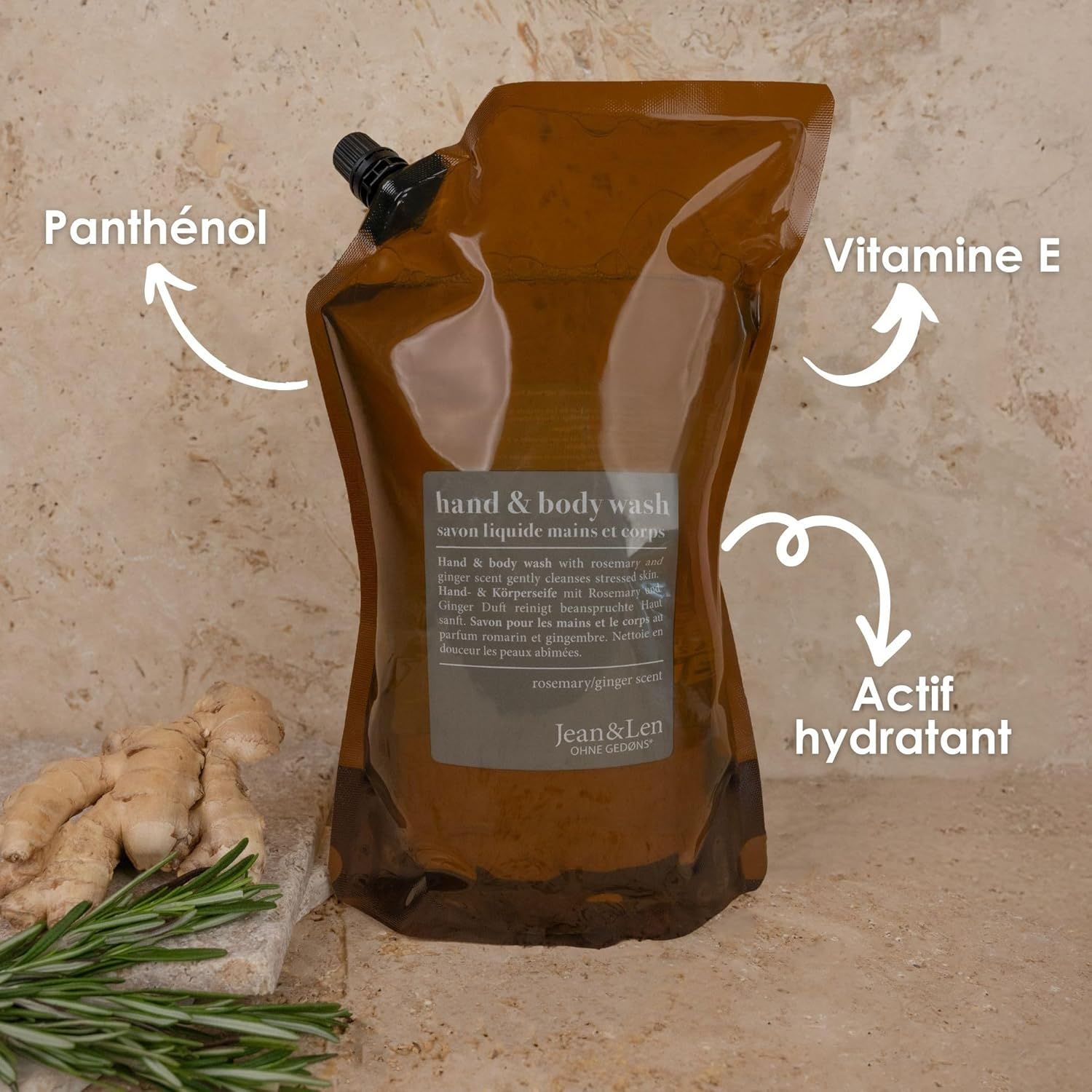 Ricarica marrone con tappo nero. Scritta: Jean & Len, Hand & Body Wash, rosmarino e zenzero. 1500 ml. Frecce sugli ingredienti.