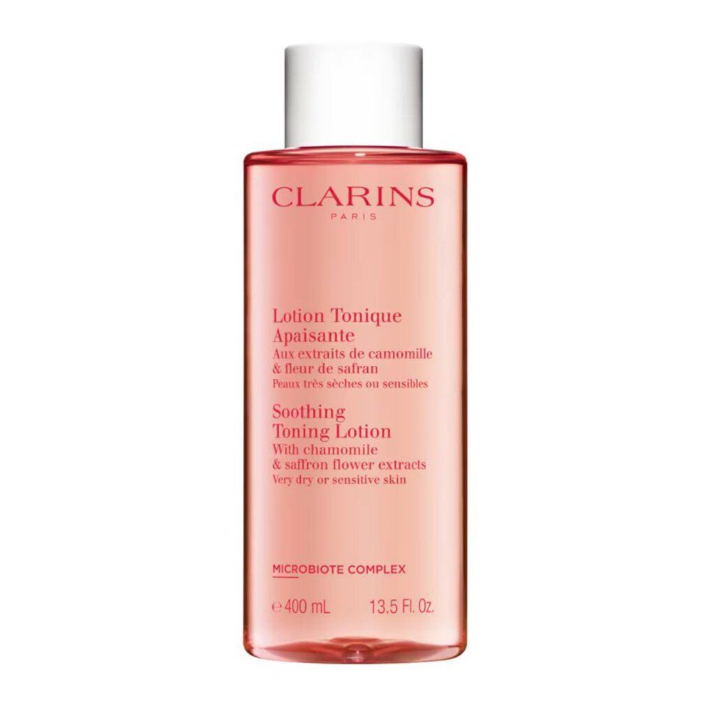 Flacone rosa trasparente con tappo bianco. Scritta: CLARINS PARIS. Testo: Lotion Tonique Apaisante. Con camomilla e fiori di zafferano. 400 ml.