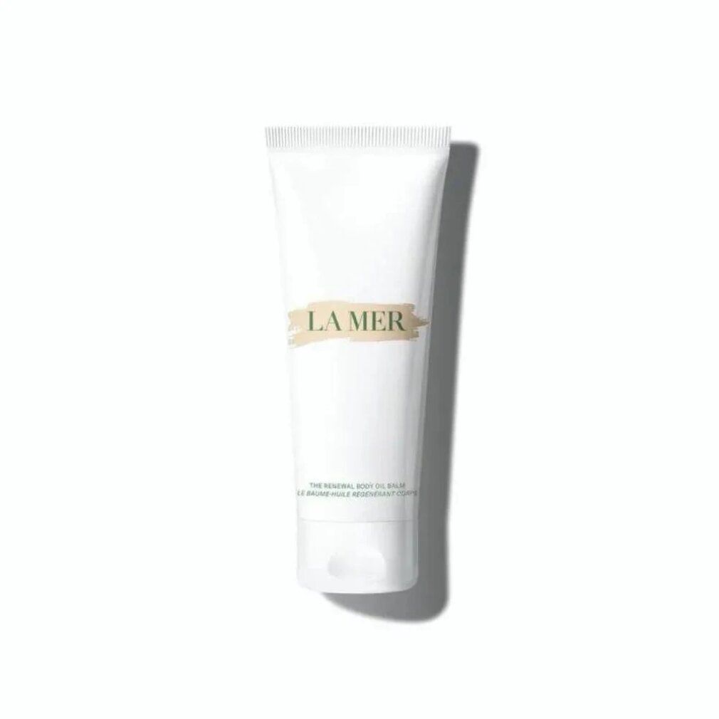 Tubo bianco con etichetta beige. Scritta: LA MER. Testo sottostante.