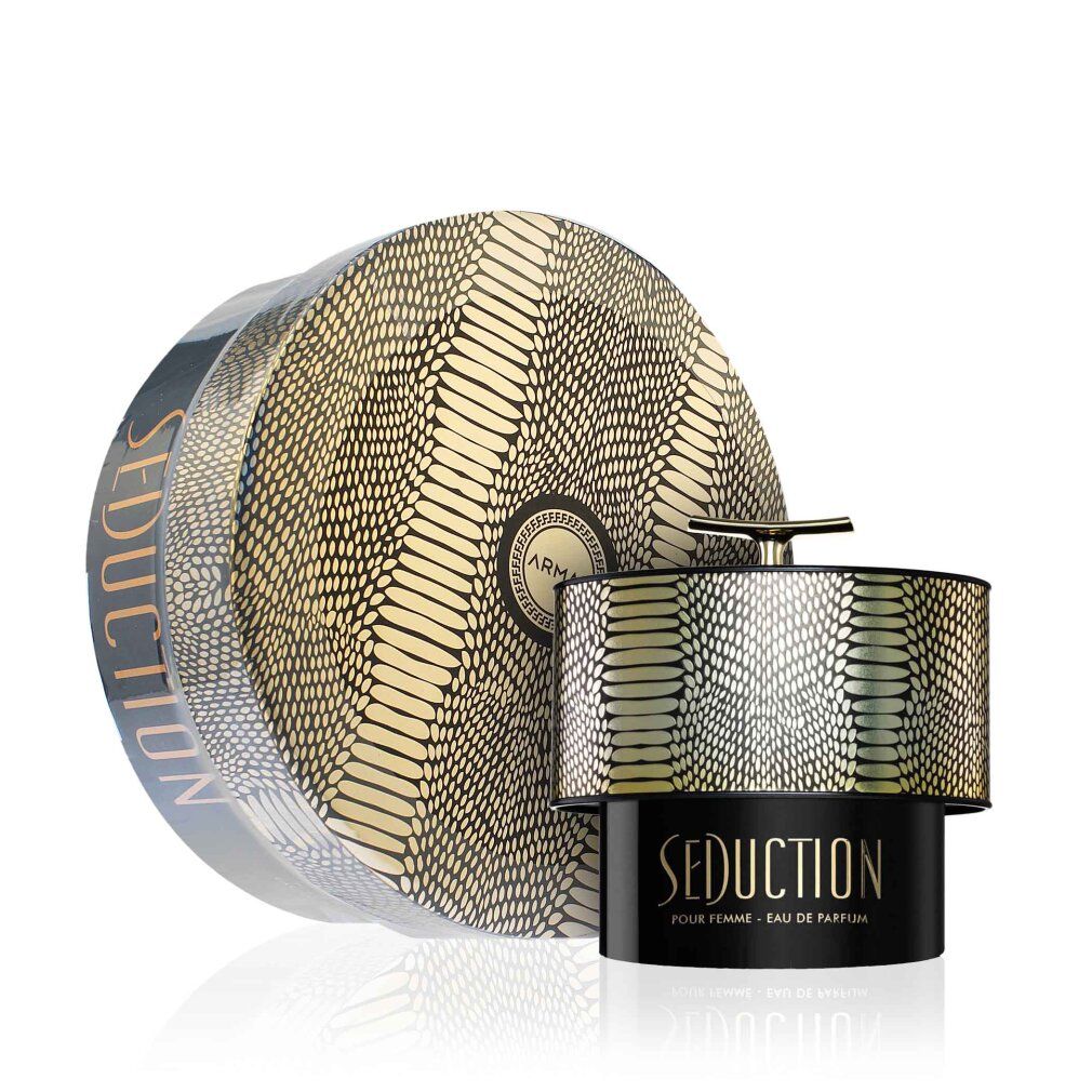 Flacone di profumo e confezione. Flacone con coperchio dorato e motivo a serpente. Confezione rotonda con lo stesso motivo.