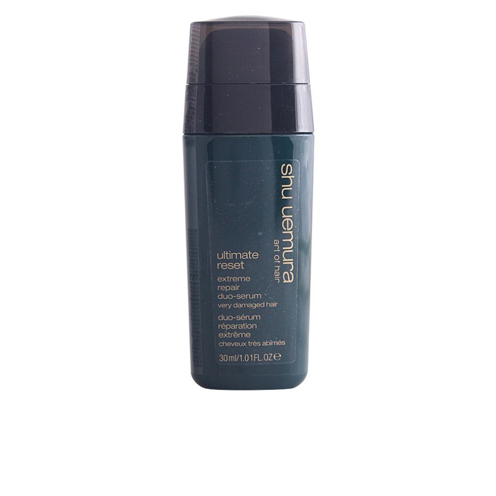 Flacone verde scuro con tappo nero. Scritta: Ultimate Reset Duo-Serum, riparazione estrema, capelli molto danneggiati. Marchio: Shu Uemura.