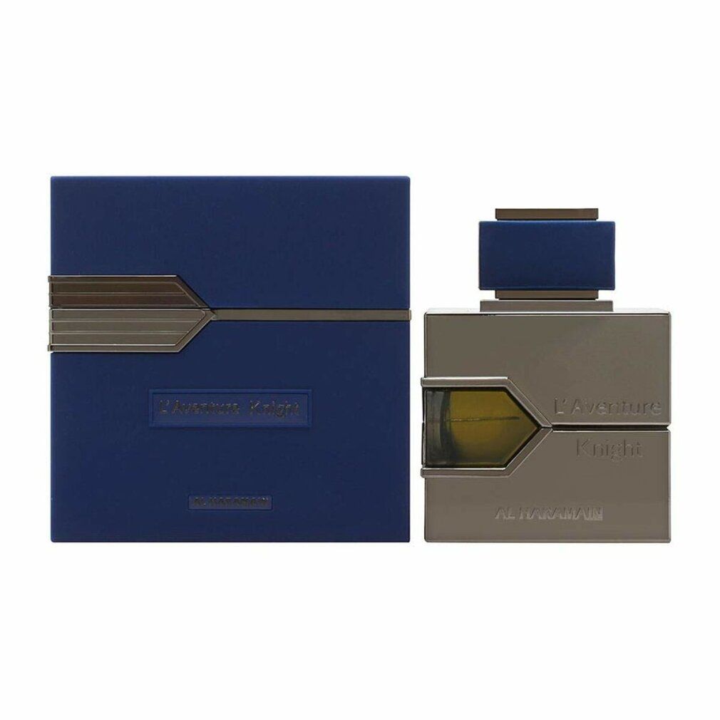 Scatola blu-grigia e flacone. Scritta: L'Aventure Knight, AL HARAMAIN. Forma rettangolare, dettagli argento.