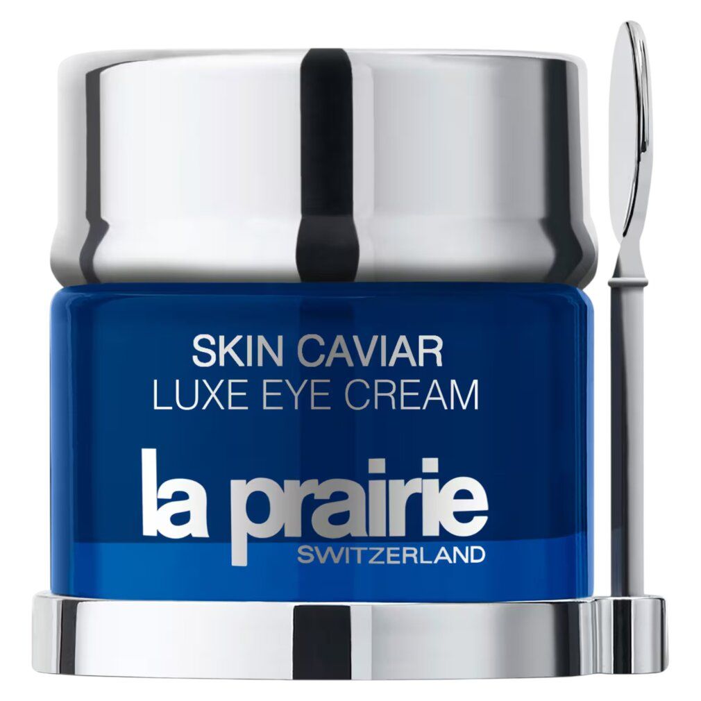 Vasetto blu con coperchio argentato e spatola. Scritta: Skin Caviar Luxe Eye Cream, La Prairie, Svizzera.