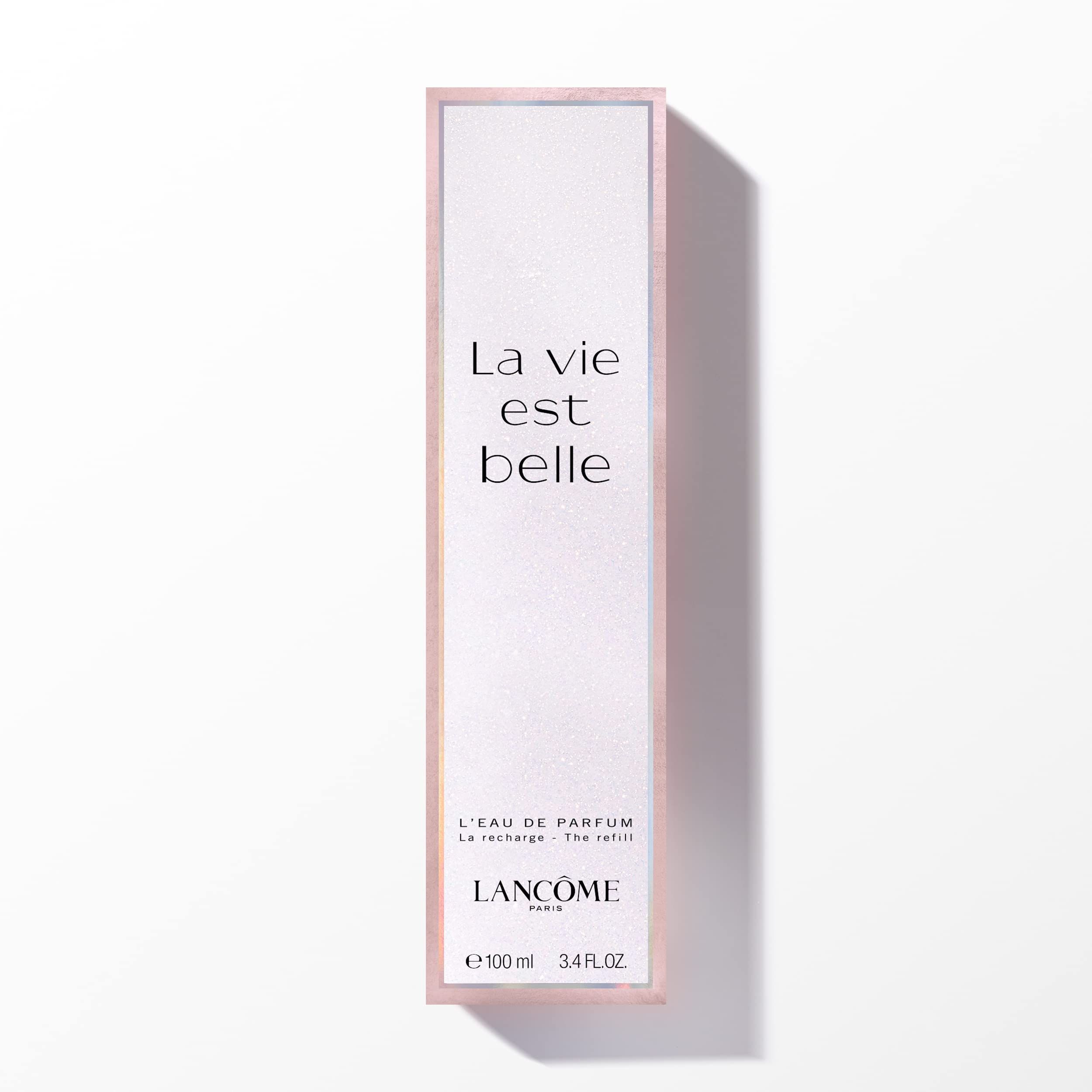 Scatola per Eau de Parfum. Design rosa e bianco con testo 'La vie est belle'.