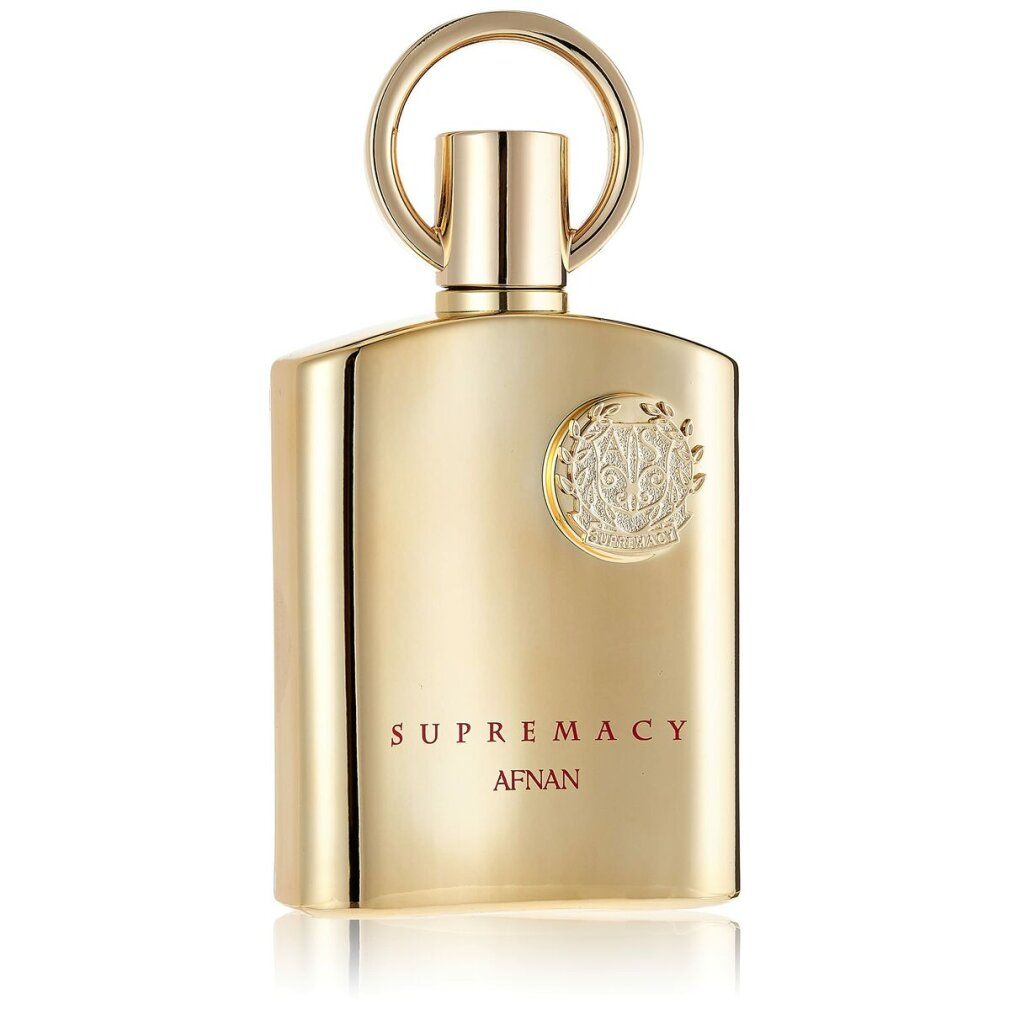 Flacone di profumo dorato con emblema argentato e chiusura ad anello. Testo: SUPREMACY AFNAN.