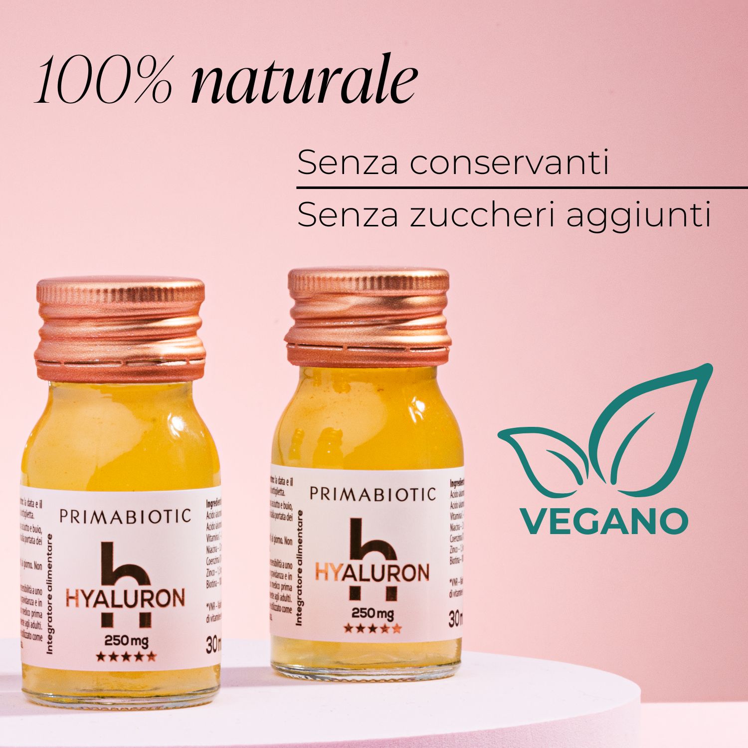 Due bottiglie con liquido giallo. Scritta: PRIMABIOTIC Hyaluron, 250 mg. Senza conservanti, senza zuccheri aggiunti. Sigillo vegano.