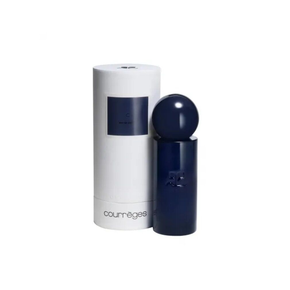 Flacone di profumo blu e confezione bianca. Scritta "C Eau de Parfum Spray" e "Courrèges". Forma cilindrica.