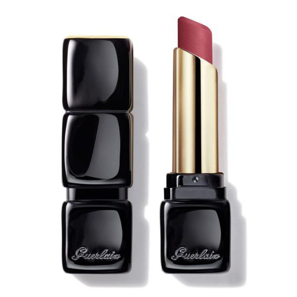 Rossetto rosa, astuccio dorato, cappuccio nero. Aperto, stick visibile. Marchio Guerlain.