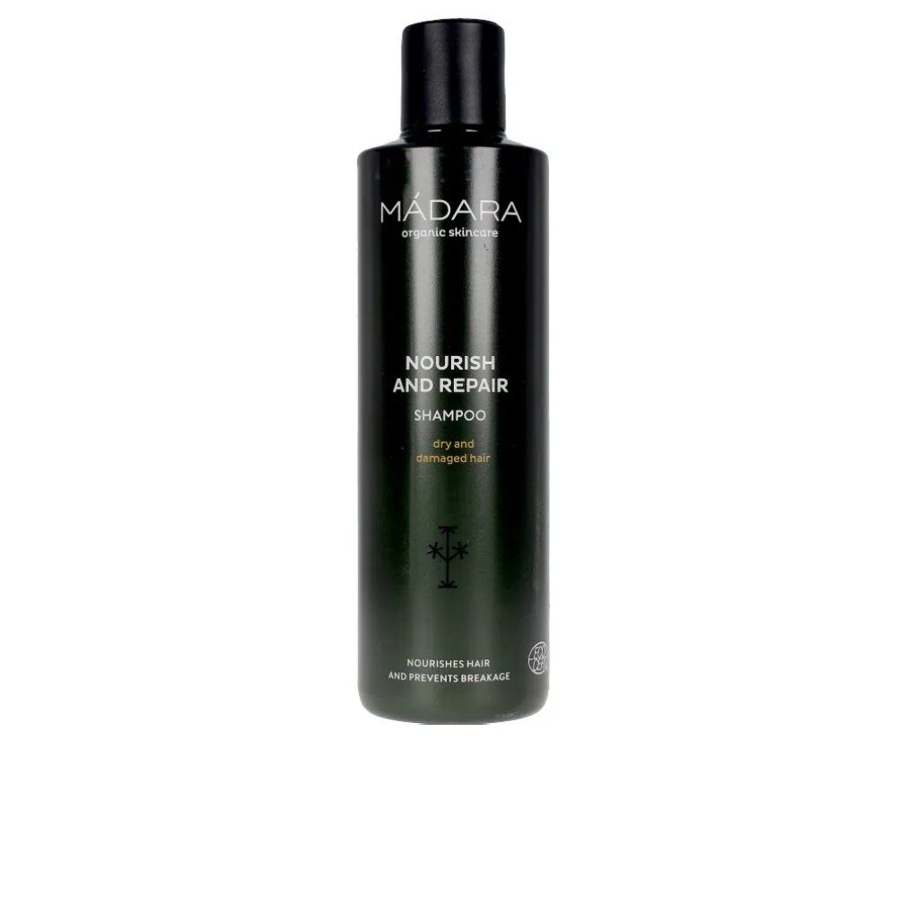 Flacone di shampoo verde scuro con tappo nero. Scritta: MÁDARA, Nourish and Repair Shampoo, per capelli secchi e danneggiati.