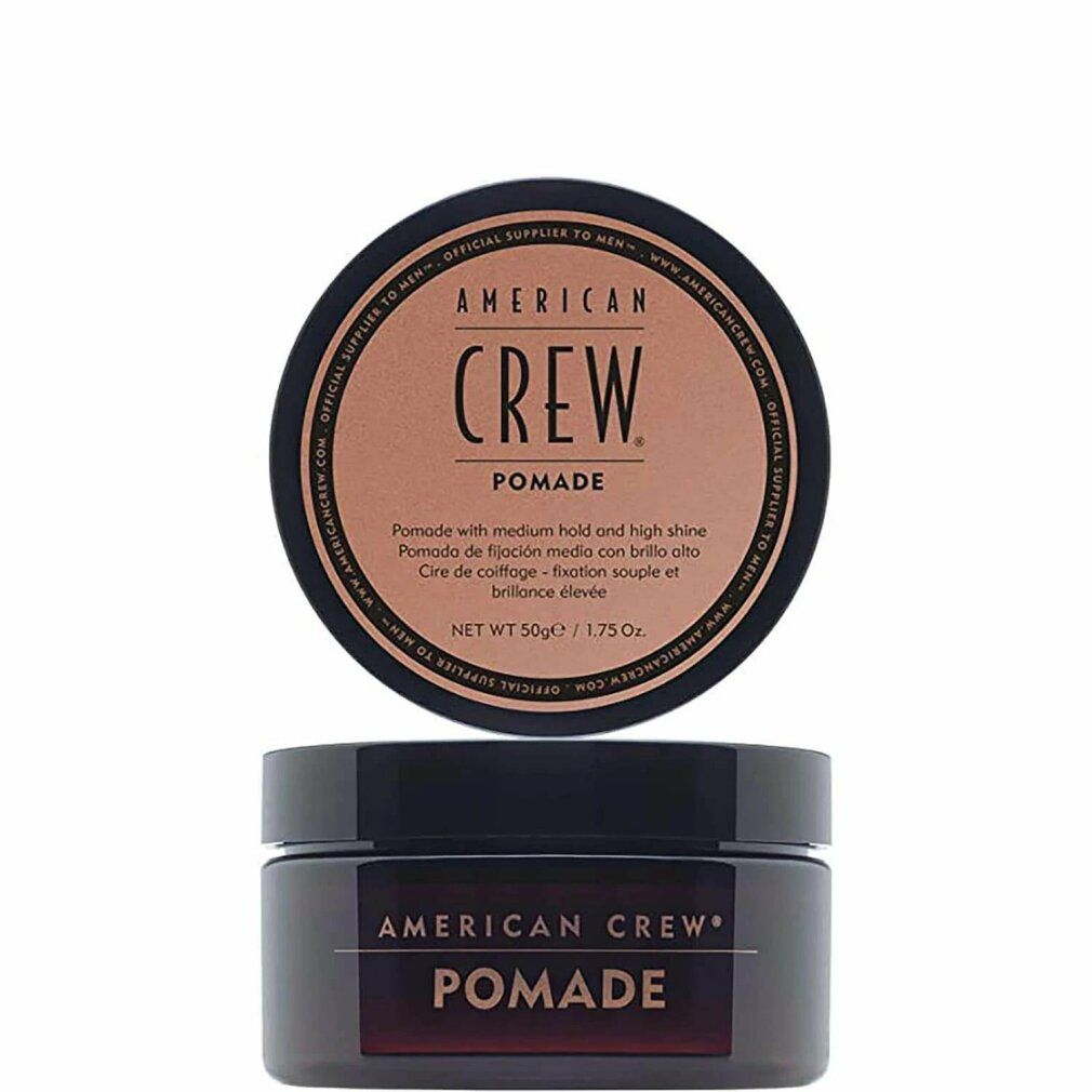 Barattolo nero con coperchio marrone. Scritta: AMERICAN CREW POMADE. Sotto, un altro barattolo.