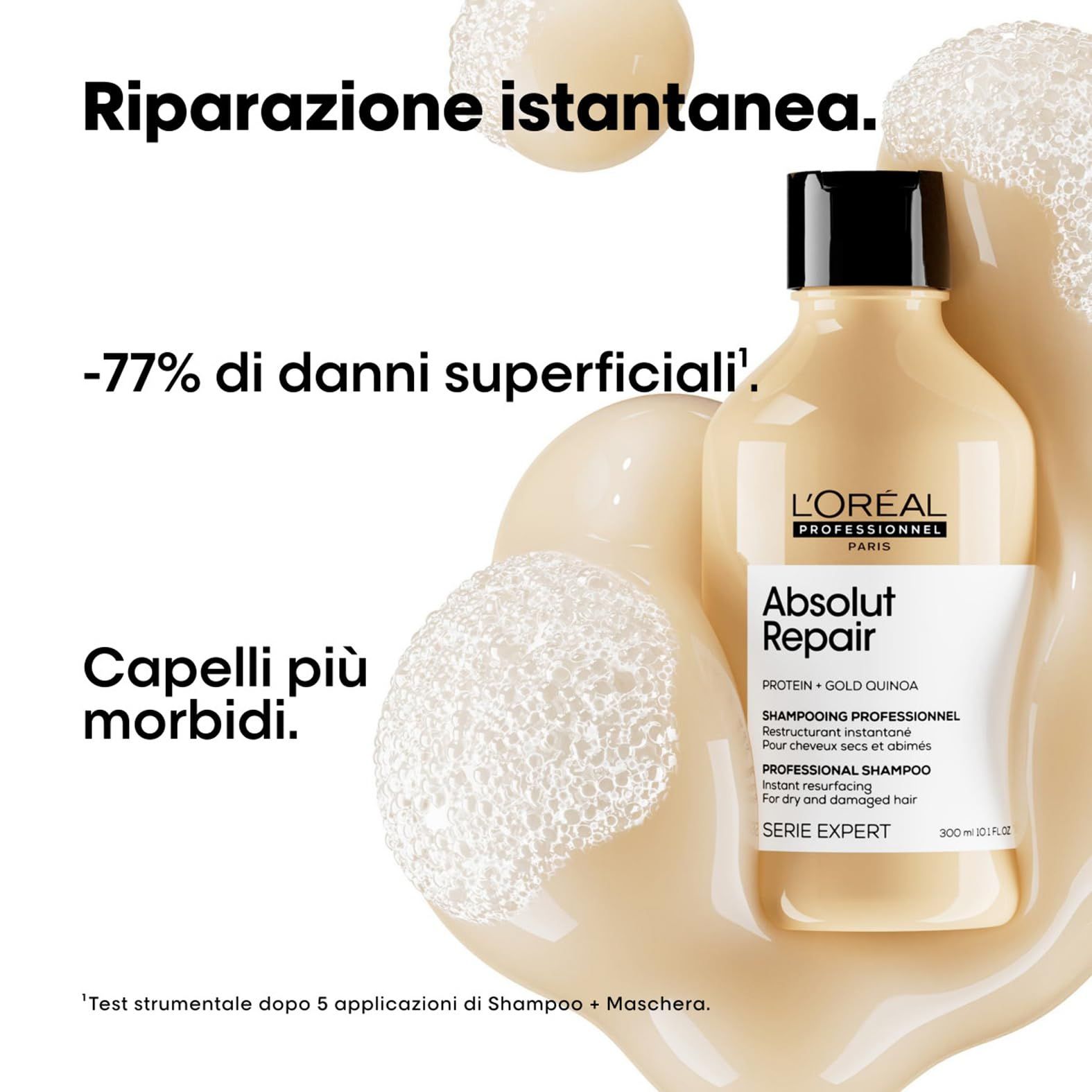Flacone di shampoo beige con tappo nero. Scritta: L'Oréal Professionnel Absolut Repair. Testo: Riparazione istantanea, -77% danni.