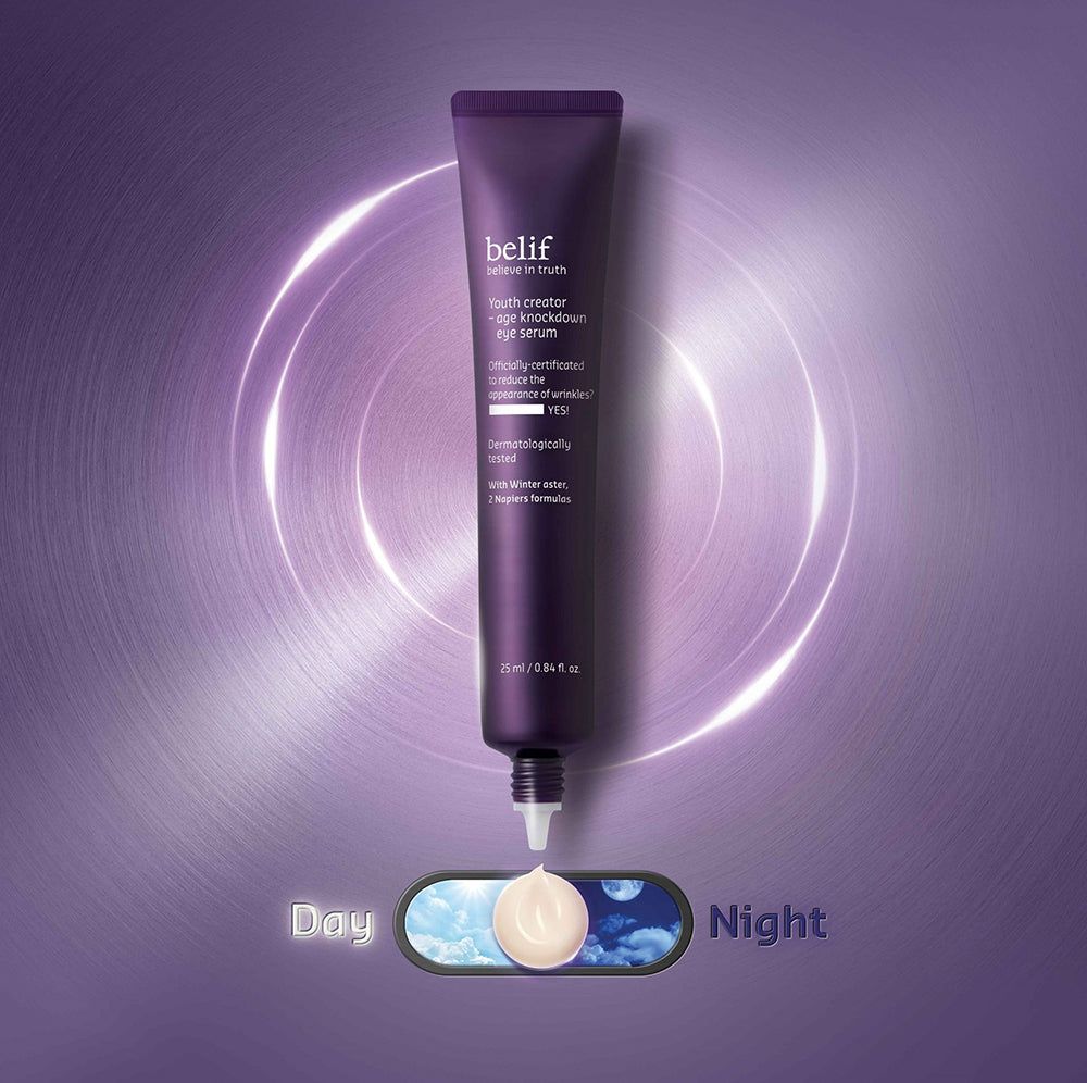 Tubo di crema contorno occhi Belif con crema applicata. Grafica interruttore giorno/notte. Sfondo viola con anelli.