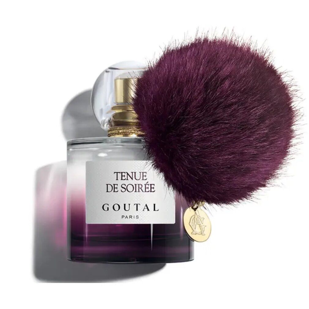 Flacone di profumo con pompon viola. Scritta: Tenue de Soirée, Goutal Paris. Chiusura dorata.