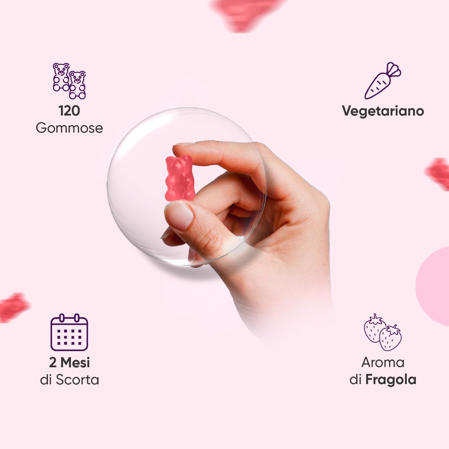 Mano che tiene un orsetto gommoso rosa. Simboli per 120 orsetti, vegetariano, 2 mesi di scorta, aroma fragola.