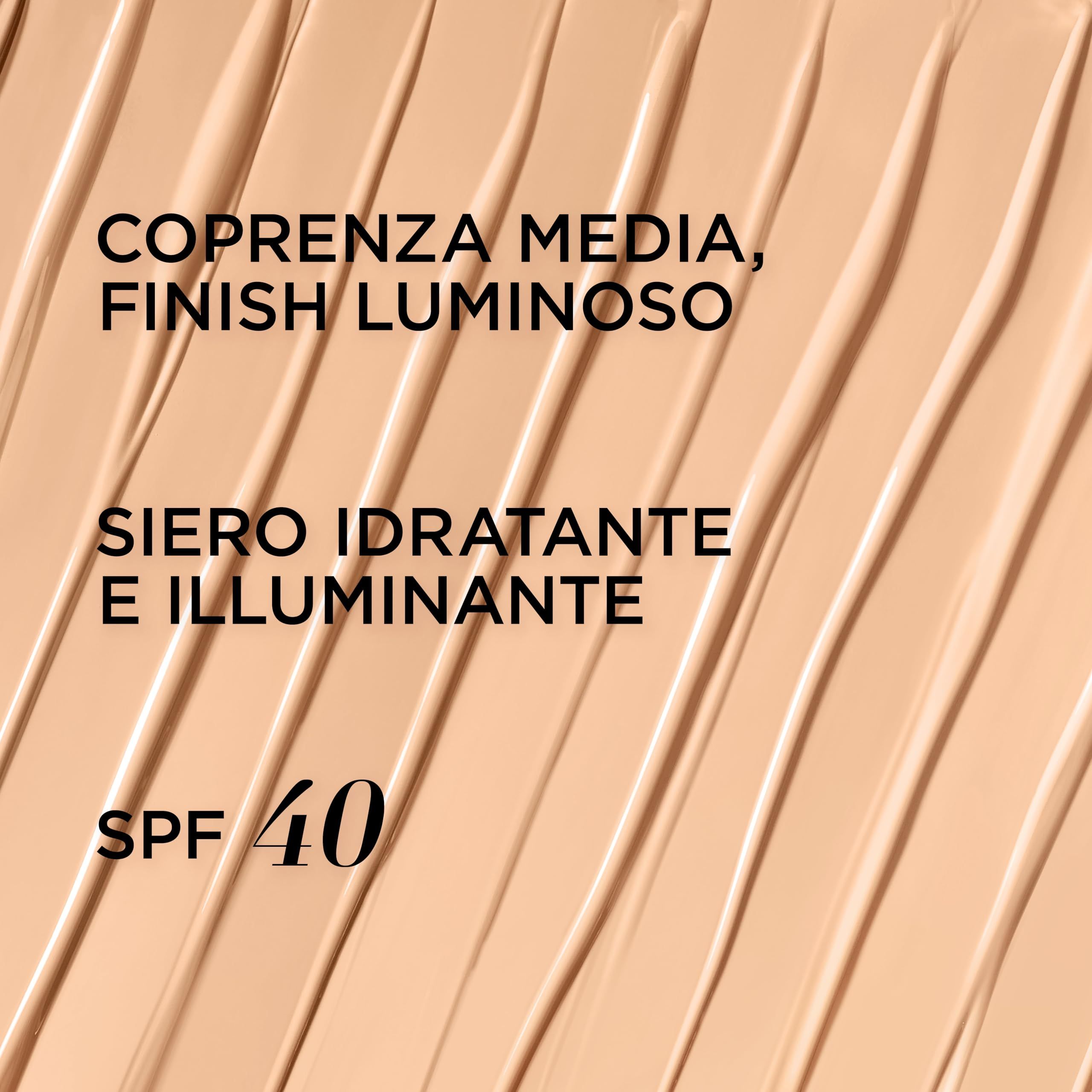 Campione di prodotto testurizzato. Testo: COPRENZA MEDIA, FINISH LUMINOSO, SIERO IDRATANTE E ILLUMINANTE, SPF 40.