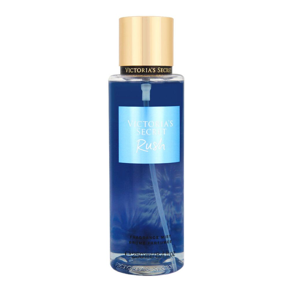 Victoria's Secret Rush Fragrance Mist. Liquido blu in flacone cilindrico con tappo dorato. Etichetta prodotto.