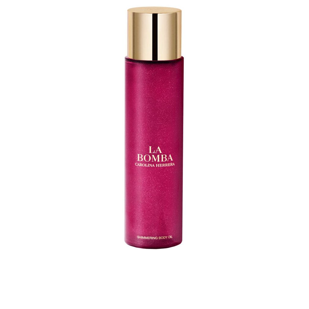 Flacone di olio per il corpo rosa con tappo dorato. Scritta: La Bomba, Carolina Herrera. Shimmering Body Oil.