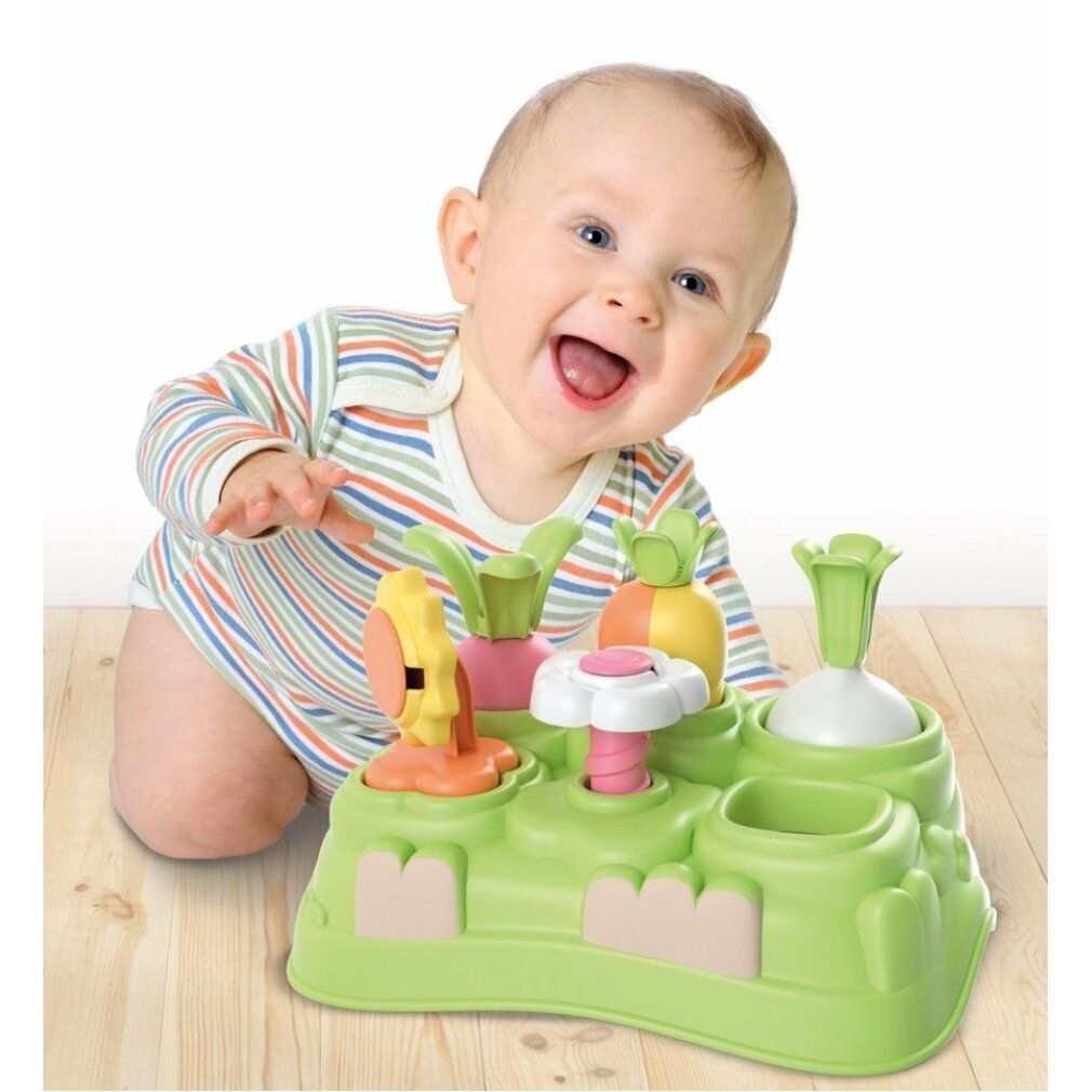 Bambino che gioca con il giocattolo verde. Diverse forme colorate. Giocattolo Baby Clementoni.